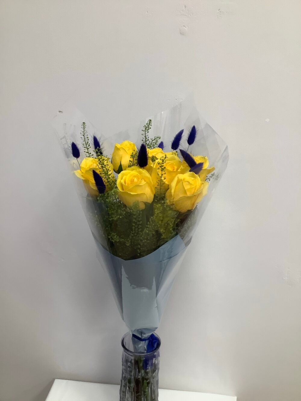 7 Yellow Roses with 11 Blue Accents - Image 4