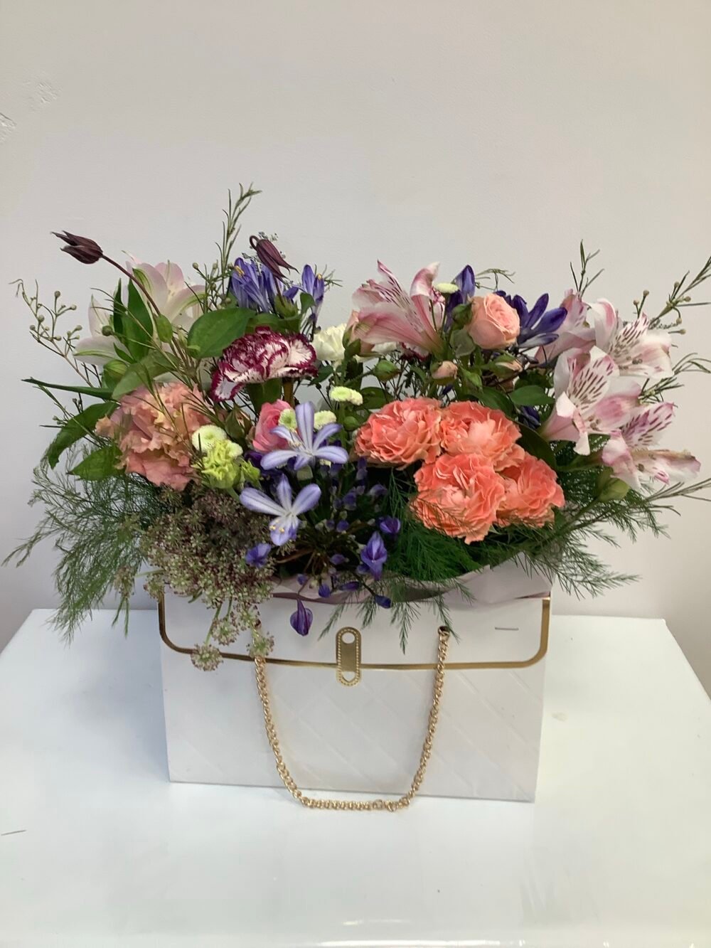 Flowers in a White Handbag